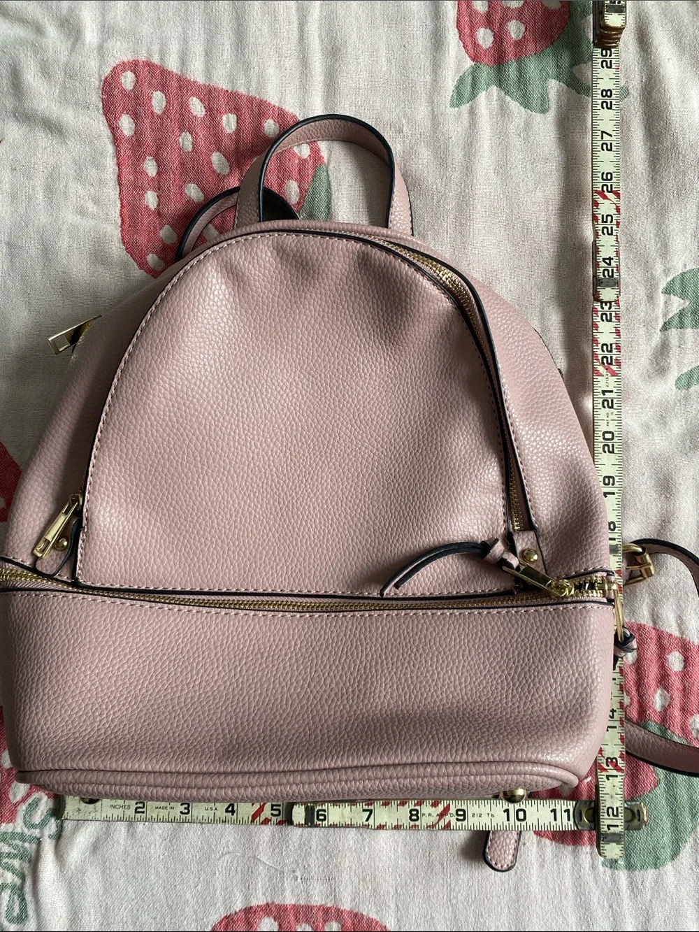 Blush Pink Mini Backpack with Gold Hardware and Striped Lining.